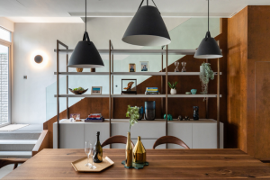 Kitchen table on the foreground and staircase in the back ground.
